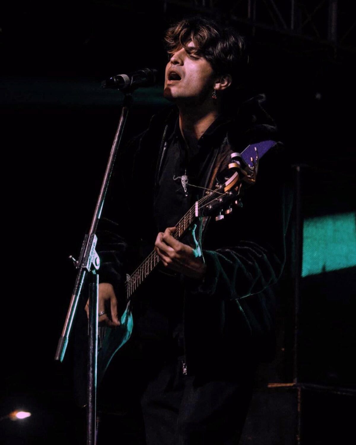 Anurag singing at a gig