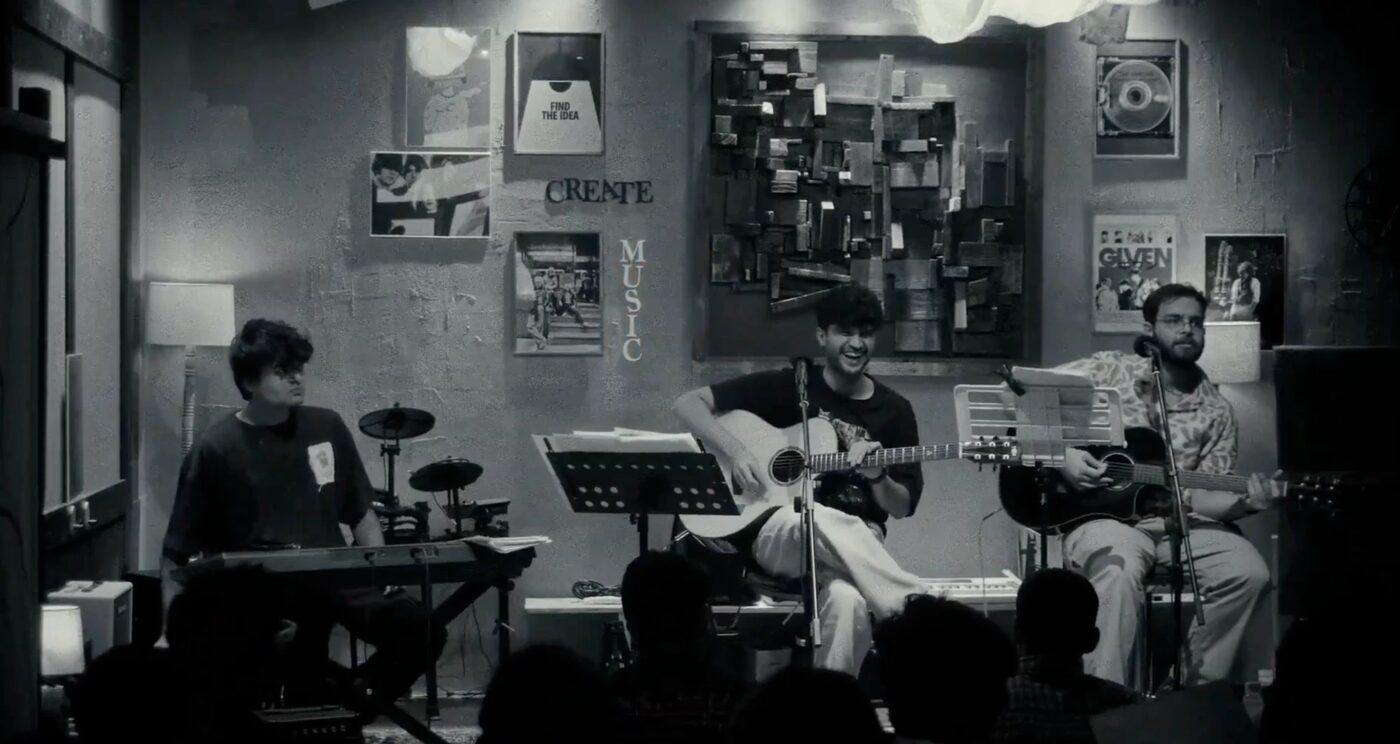 Anurag playing with a band at a cafe